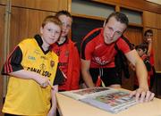 6 September 2010; Down Captain Ambrose Rodgers along with Farron and Ryan O'Hare during a fans open night ahead of their upcoming GAA Football All-Ireland Championship final against Cork. Abbey Grammar School, Newry, Co. Down. Picture credit: Oliver McVeigh / SPORTSFILE
