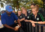 8 September 2010; Republic of Ireland players watch on as a local vendor cracks open a coconut at Maracas Bay ahead of their side's second group stage game of the FIFA U-17 Women’s World Cup, against Canada, on Thursday. Republic of Ireland at the FIFA U-17 Women’s World Cup - Wednesday 8th September, Maracas Bay, Port of Spain, Trinidad. Picture credit: Stephen McCarthy / SPORTSFILE