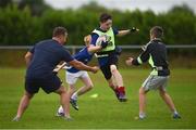 20 July 2016; Devin Byrne, aged 11, from Tullow, Co. Carlow, is tackled by Bryan Byrne of Leinster during the Bank of Ireland Leinster Rugby Summer Camp at Tullow RFC in Tullow, Co Carlow. Photo by Daire Brennan/Sportsfile