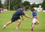 20 July 2016; Bryan Byrne of Leinster in action against Sean Doyle, aged 7, from Kilcarry, Co. Carlow during the Bank of Ireland Leinster Rugby Summer Camp at Tullow RFC in Tullow, Co Carlow. Photo by Daire Brennan/Sportsfile