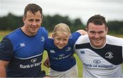 20 July 2016; Roisín Clinch, aged 8, from Castledermot, Co. Kildare, with Bryan Byrne, left, and Peter Dooley of Leinster during the Bank of Ireland Leinster Rugby Summer Camp at Tullow RFC in Tullow, Co Carlow. Photo by Daire Brennan/Sportsfile