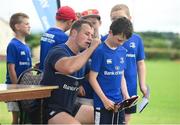 20 July 2016; Bryan Byrne of Leinster signs the jersey of Alfie Barcoe, aged 9, from Leighlinbridge, Co. Carlow, in action during the Bank of Ireland Leinster Rugby Summer Camp at Tullow RFC in Tullow, Co Carlow. Photo by Daire Brennan/Sportsfile