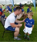 20 July 2016; Peter Dooley of Leinster signs the jersey of Conor O'Neill, aged 6, from Tullow, Co. Carlow, during the Bank of Ireland Leinster Rugby Summer Camp at Tullow RFC in Tullow, Co Carlow. Photo by Daire Brennan/Sportsfile