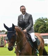 20 July 2016; Cian O'Connor, Ireland, takes a lap of honour on Aramis 573 after winning the Speed Stakes at the Dublin Horse Show in the RDS, Ballsbridge, Dublin. Photo by Cody Glenn/Sportsfile