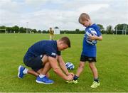 21 July 2016; Josh van der Flier of Leinster ties the shoelaces of Calum Murphy, aged 9, from Ballybrophy, Co. Laois, during the Bank of Ireland Leinster Rugby Summer Camp at Portlaoise RFC in Portlaoise, Co. Laois. Photo by Daire Brennan/Sportsfile