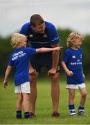 21 July 2016; Billy Cooper, aged 7, from Coolrain, Co. Laois, gives instructions to Ross Molony of Leinster during the Bank of Ireland Leinster Rugby Summer Camp at Portlaoise RFC in Portlaoise, Co. Laois. Photo by Daire Brennan/Sportsfile