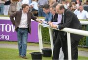 21 July 2016; Trainer Johnny Murtagh is interviewed by journalists after sending out Windsor Beach to win the Morocco Sorec Apprentice Handicap during the Bulmers Evening Meeting at Leopardstown in Dublin. Photo by Cody Glenn/Sportsfile