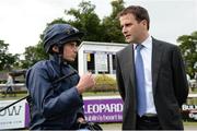 21 July 2016; Jockey Ryan Moore in conversation with JP Magnier, son of part-owner John Magnier after winning the Jockey Club of Turkey Silver Flash Stakes on Promise To Be True during the Bulmers Evening Meeting at Leopardstown in Dublin. Photo by Cody Glenn/Sportsfile
