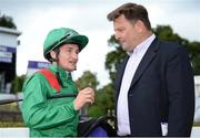 21 July 2016; Jockey Shane Foley in conversation with Pat Downes, racing manager H H Aga Khan, after winning the Racecourse of the Year Handicap during the Bulmers Evening Meeting at Leopardstown in Dublin. Photo by Cody Glenn/Sportsfile