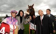11 September 2010; Sans Frontieres, with jockey Olivier Peslier, Cleide Silva and owner Sir Robert Ogden, after winning the Irish Field St. Leger. The Curragh Racecourse, Co. Kildare. Picture credit: Barry Cregg / SPORTSFILE