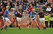 11 September 2010; Patrick Maher, Tipperary, hand passes the ball to team-mate Seán Carey, before the challenge from David Burke, left, and Sylvie Óg Linnane, Galway. Bord Gais Energy GAA Hurling Under 21 All-Ireland Championship Final, Tipperary v Galway, Semple Stadium, Thurles, Co. Tipperary. Picture credit: Barry Cregg / SPORTSFILE