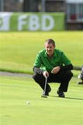 12 September 2010; Bill Heneghan from John McBrides / Chicago, lines up a putt on the 18th green during the FBD All-Ireland GAA Golf Challenge 2010 Final. Faithlegg House Hotel & Golf Club, Faithlegg, Co. Waterford. Picture credit: Diarmuid Greene / SPORTSFILE