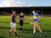 11 September 2010; The Tipperary captain Padraic Maher greets the Galway captain David Burke in the company of referee James McGrath. Bord Gais Energy GAA Hurling Under 21 All-Ireland Championship Final, Tipperary v Galway, Semple Stadium, Thurles, Co. Tipperary. Picture credit: Ray McManus / SPORTSFILE