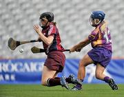 12 September 2010; Katrina Parrock, Wexford, beats Galway goalkeeper Susan Earner to score her side's first goal. Gala All-Ireland Senior Camogie Championship Final, Galway v Wexford, Croke Park, Dublin. Picture credit: David Maher / SPORTSFILE