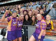 12 September 2010; Wexford players Mags D'Arcy, left, Ursula Jacob and Helena Jacob, right, celebrate with fans after the game. Gala All-Ireland Senior Camogie Championship Final, Galway v Wexford, Croke Park, Dublin. Picture credit: Oliver McVeigh / SPORTSFILE