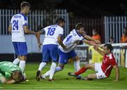 21 July 2016; Christy Fagan of St Patrick's Athletic is pushed over by  Dinamo Minsk players during the UEFA Europa League Second Qualifying Round 2nd Leg match between St Patrick's Athletic and Dinamo Minsk at Richmond Park in Inchicore, Dublin. Photo by David Maher/Sportsfile