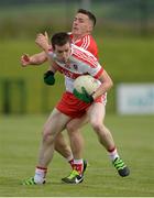 18 June 2016; Niall Loughlin of Derry in action against Adrian Reid of Louth during the GAA Football All-Ireland Senior Championship Qualifier Round 1A match between Derry and Louth at Owenbeg Centre of Excellence in Dungiven, Derry. Photo by Oliver McVeigh/Sportsfile