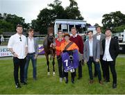 21 July 2016; Jockey Gary Carroll, trainer Thomas Mullen, fourth from right, and members of the Booka Brass Band with winning horse Tara Dylan following the Booka Brass Band Handicap during the Bulmers Evening Meeting at Leopardstown in Dublin. Photo by Cody Glenn/Sportsfile