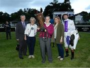 21 July 2016; Jockey Kevin Manning, trainer Jim Bolger and winning connections of Siamsaiocht after the Bulmers Live At Leopardstown Rated Race during the Bulmers Evening Meeting at Leopardstown in Dublin. Photo by Cody Glenn/Sportsfile