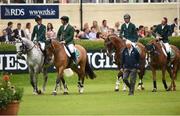 22 July 2016; Members of the Ireland team, from left, Bertram Allen, Cian O'Connor, Denis Lynch and Greg Broderick enter the main arena with Chef d'Equipe Robert Splain after placing second in a jump-off against Italy following the Furusiyya FEI Nations Cup presented by Longines at the Dublin Horse Show in the RDS, Ballsbridge, Dublin. Photo by Cody Glenn/Sportsfile