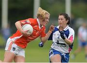 23 July 2016; Kelly Mallon of Armagh in action against Linda Wall of Waterford during the TG4 Ladies Football All-Ireland Senior Championship Preliminary Round match between Armagh and Waterford at Conneff Park in Clane, Co Kildare. Photo by Eóin Noonan/Sportsfile