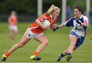 23 July 2016; Kelly Mallon of Armagh in action against Linda Wall of Waterford during the TG4 Ladies Football All-Ireland Senior Championship Preliminary Round match between Armagh and Waterford at Conneff Park in Clane, Co Kildare. Photo by Eóin Noonan/Sportsfile