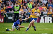 23 July 2016; Enda Smith of Roscommon is tackled by Martin McMahon of Clare during the GAA Football All-Ireland Senior Championship, Round 4A, game between Clare and Roscommon at Pearse Stadium in Salthill, Galway. Photo by Brendan Moran/Sportsfile