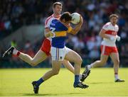 23 July 2016; Philip Austin of Tipperary in action against Niall Holly of Derry during their GAA Football All-Ireland Senior Championship, Round 4A, game at Kingspan Breffni Park in Co Cavan. Photo by Oliver McVeigh/Sportsfile