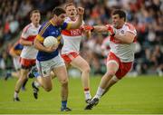 23 July 2016; Philip Austin of Tipperary in action against Mark Lynch of Derry during their GAA Football All-Ireland Senior Championship, Round 4A, game at Kingspan Breffni Park in Co Cavan. Photo by Oliver McVeigh/Sportsfile