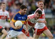 23 July 2016; Philip Austin of Tipperary in action against Mark Lynch of Derry during their GAA Football All-Ireland Senior Championship, Round 4A, game at Kingspan Breffni Park in Co Cavan. Photo by Oliver McVeigh/Sportsfile