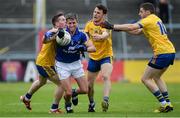 23 July 2016; Gordon Kelly of Clare in action against, from left, Seá McDermott, Diarmuid Murtagh and Fintan Cregg of Roscommon during the GAA Football All-Ireland Senior Championship, Round 4A, game between Clare and Roscommon at Pearse Stadium in Salthill, Galway. Photo by Brendan Moran/Sportsfile