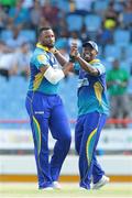 23 July 2016; Tridents Kieron Pollard (L) and Navin Stewart (R) celebrate the wicket of Andre Fletcher during Match 22 of the Hero Caribbean Premier League St Lucia Zouks v Barbados Tridents at the Daren Sammy Cricket Stadium in Gros Islet, St Lucia. Photo by Ashley Allen/Sportsfile