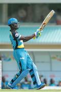 23 July 2016; Zouks batsman Andre Fletcher hits six during Match 22 of the Hero Caribbean Premier League St Lucia Zouks v Barbados Tridents at the Daren Sammy Cricket Stadium in Gros Islet, St Lucia. Photo by Ashley Allen/Sportsfile