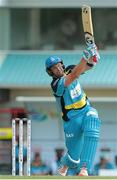 23 July 2016; Zouks batsman Shane Watson hits his during Match 22 of the Hero Caribbean Premier League St Lucia Zouks v Barbados Tridents at the Daren Sammy Cricket Stadium in Gros Islet, St Lucia. Photo by Ashley Allen/Sportsfile