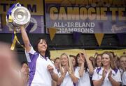 13 September 2010; Wexford Captain Una Lacey holds aloft the O'Duffy Cup at the homecoming parade on their return home as Gala All-Ireland Senior Camogie Champions, Wexford Quay, Wexford. Picture credit: Mark McGrath / SPORTSFILE