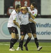 13 September 2010; Dundalk's Tom Miller, centre, is congratulated by team-mates Fahrudin Kuduzovic, left, and Gary Breen after scoring his side's first goal. Airtricity League Premier Division, Dundalk v Shamrock Rovers, Oriel Park, Dundalk, Co. Louth. Picture credit: Oliver McVeigh / SPORTSFILE
