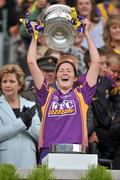 12 September 2010; Catherine O'Loughlin, Wexford, lifts the O'Duffy Cup. Gala All-Ireland Senior Camogie Championship Final, Galway v Wexford, Croke Park, Dublin. Picture credit: David Maher / SPORTSFILE