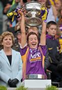 12 September 2010; Kate Kelly, Wexford, lifts the O'Duffy Cup. Gala All-Ireland Senior Camogie Championship Final, Galway v Wexford, Croke Park, Dublin. Picture credit: David Maher / SPORTSFILE