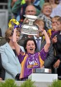 12 September 2010; Claire O'Connor, Wexford, lifts the O'Duffy Cup. Gala All-Ireland Senior Camogie Championship Final, Galway v Wexford, Croke Park, Dublin. Picture credit: David Maher / SPORTSFILE