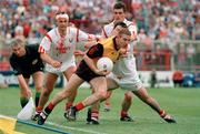 14 August 1994; Ross Carr, Down, in action against Tony Davis, left, Liam Honohan and Stephen Calnan, Cork. Bank of Ireland Football Championship Semi-Final, Down v Cork, Croke Park, Dublin. Picture credit: David Maher / SPORTSFILE