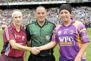 12 September 2010; Referee Karl O'Brien with Galway captain Therese Maher, left, and Wexford captain Una Lacey before the game. Gala All-Ireland Senior Camogie Championship Final, Galway v Wexford, Croke Park, Dublin. Picture credit: Oliver McVeigh / SPORTSFILE