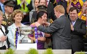 12 September 2010; Gary Desmond, Chief Executive, Gala, presenting Wexford captain Una Leacy with her winners medal. Gala All-Ireland Senior Camogie Championship Final, Galway v Wexford, Croke Park, Dublin. Picture credit: Oliver McVeigh / SPORTSFILE