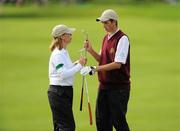 15 September 2010; Mark Holmes, Naas Golf Club, Co. Kildare, and his mother Kate, who was his caddie for the round, exchange clubs during the Bulmers Junior Cup Semi-Final. Bulmers Cups and Shields Finals 2010, Castlebar Golf Club, Co. Mayo. Picture credit: Ray McManus / SPORTSFILE