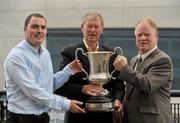 16 September 2010; RTE Radio commentator Michéal O Muircheartaigh holds the Cormac McAnallen Trophy with Stephen Comerford, left, and Brendan McAnallen, during a press conference to raise funds for the Cormac McAnallen Trust which go directly to screening services and the purchase of defibrillators to help combat Sudden Adult Death Syndrome. The campaign hopes to have 100,000 texts to the number 53306 in the Republic of Ireland and 81108 in Northern Ireland, by full-time in Sunday's All-Ireland Senior Football Final between Down and Cork, which will be O Muircheartaigh's final commentary at a GAA Football All-Ireland Championship Final before his retirement. Micheal O'Muircheartaigh Press Conference, Croke Park Hotel, Jones's Road, Dublin. Picture credit: Barry Cregg / SPORTSFILE