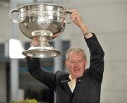 16 September 2010; RTE Radio commentator Michéal O Muircheartaigh holds up the Sam Maguire Cup during a press conference to raise funds for the Cormac McAnallen Trust which go directly to screening services and the purchase of defibrillators to help combat Sudden Adult Death Syndrome. The campaign hopes to have 100,000 texts to the number 53306 in the Republic of Ireland and 81108 in Northern Ireland, by full-time in Sunday's All-Ireland Senior Football Final between Down and Cork, which will be O Muircheartaigh's final commentary at a GAA Football All-Ireland Championship Final before his retirement. Micheal O'Muircheartaigh Press Conference, Croke Park Hotel, Jones's Road, Dublin. Picture credit: Barry Cregg / SPORTSFILE