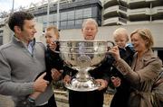 16 September 2010; RTE Radio commentator Michéal O Muircheartaigh holds on to the Sam Maguire Cup with grandsons twins Eoghan, left, and Liam, aged 2, along with Dominic Wilkinson and daughter Neasa during a press conference to raise funds for the Cormac McAnallen Trust which go directly to screening services and the purchase of defibrillators to help combat Sudden Adult Death Syndrome. The campaign hopes to have 100,000 texts to the number 53306 in the Republic of Ireland and 81108 in Northern Ireland, by full-time in Sunday's All-Ireland Senior Football Final between Down and Cork, which will be O Muircheartaigh's final commentary at a GAA Football All-Ireland Championship Final before his retirement. Micheal O'Muircheartaigh Press Conference, Croke Park Hotel, Jones's Road, Dublin. Picture credit: Barry Cregg / SPORTSFILE