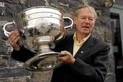 16 September 2010; RTE Radio commentator Michéal O Muircheartaigh holds up the Sam Maguire Cup during a press conference to raise funds for the Cormac McAnallen Trust which go directly to screening services and the purchase of defibrillators to help combat Sudden Adult Death Syndrome. The campaign hopes to have 100,000 texts to the number 53306 in the Republic of Ireland and 81108 in Northern Ireland, by full-time in Sunday's All-Ireland Senior Football Final between Down and Cork, which will be O Muircheartaigh's final commentary at a GAA Football All-Ireland Championship Final before his retirement. Micheal O'Muircheartaigh Press Conference, Croke Park Hotel, Jones's Road, Dublin. Picture credit: Barry Cregg / SPORTSFILE