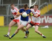 23 July 2016; Conor Sweeney of Tipperary in action against Ciaran McFaul and Brendan Rogers of Derry during the GAA Football All-Ireland Senior Championship, Round 4A, game at Kingspan Breffni Park in Co Cavan. Photo by Oliver McVeigh/Sportsfile