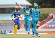 23 July 2016; Zouks captain Daren Sammy (C) celebrates the wicket of Ahmed Shahzad (out of shot) as Andre Fletcher (R) completes the catch and Kyle Hope (L) looks on during Match 22 of the Hero Caribbean Premier League St Lucia Zouks v Barbados Tridents at the Daren Sammy Cricket Stadium in Gros Islet, St Lucia. Photo by Ashley Allen/Sportsfile
