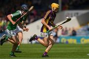24 July 2016; Damien Reck of Wexford in action against Ronan Connelly of Limerick during the Electric Ireland GAA Hurling All-Ireland Minor Championship quarter final match between Wexford and Limerick at Semple Stadium in Thurles, Co Tipperary. Photo by Ray McManus/Sportsfile